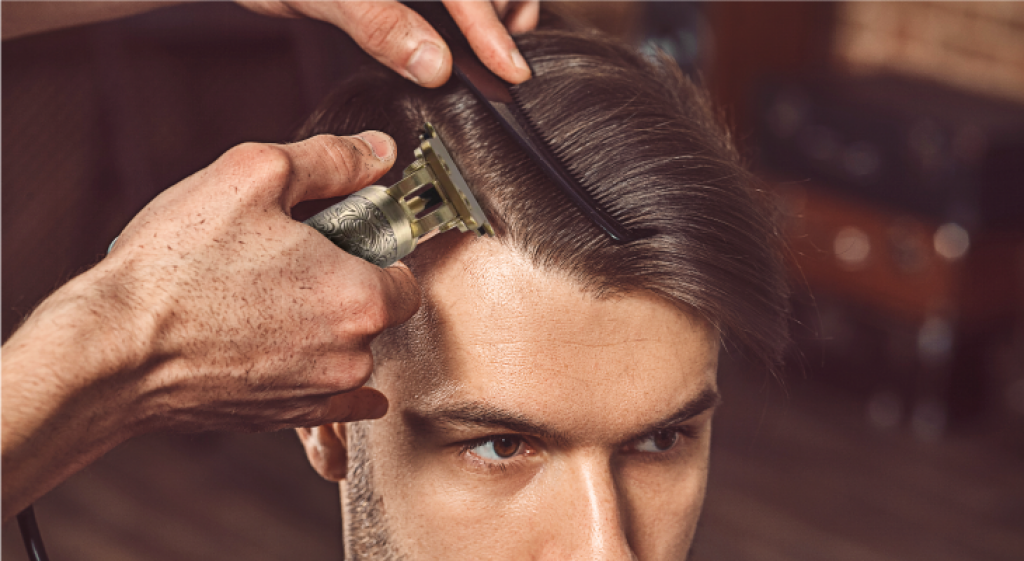 Barber using the Trimsher